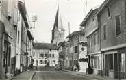 01 Ain CPSM FRANCE 01 "St Trivier de Courtes, La grande rue et l'église".